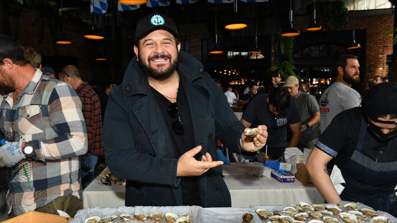Adam Richman with an oyster