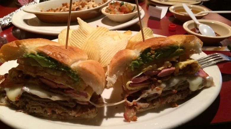 the Torta del Rey sandwich on a plate with chips