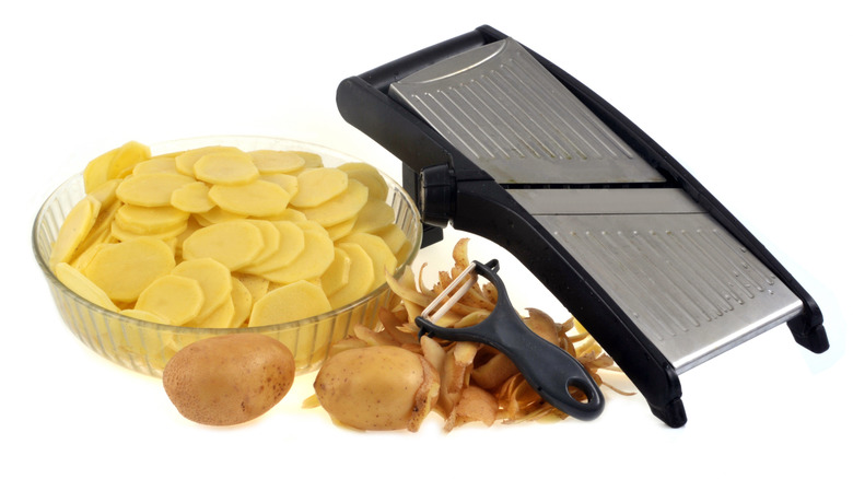 Mandoline and sliced potatoes