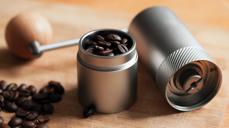 Manual coffee grinder and beans