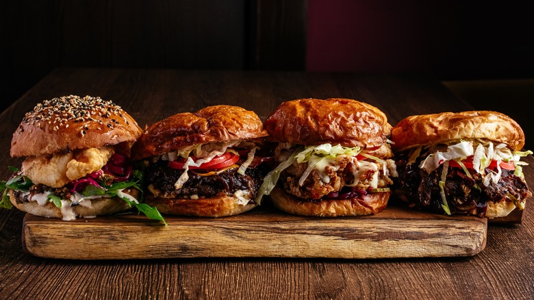 Burgers with various meat on wood