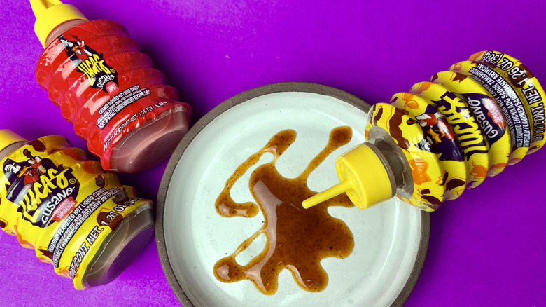The Gusano liquid candy squeeze bottles and a plate of liquid candy