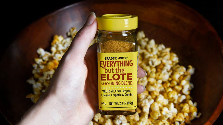 Everything But The Elote jar above popcorn bowl