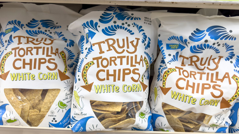 three bags of Truly Tortilla Chips on a shelf