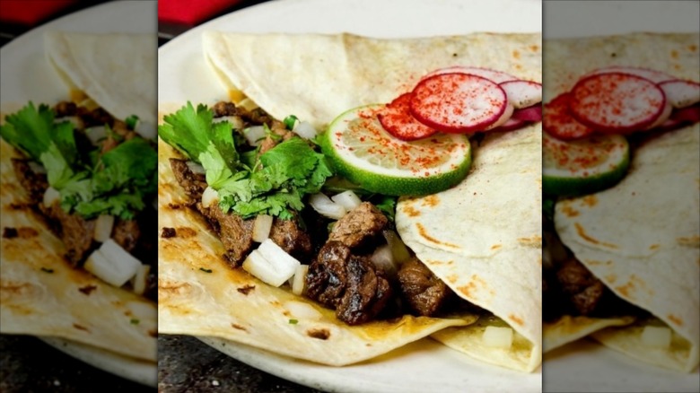 Beef tacos at Nuevo Laredo Cantina, topped with slice of lime