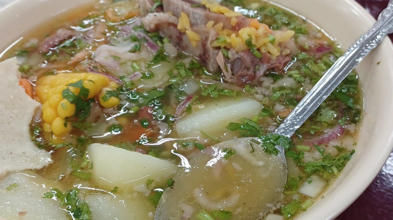 a traditional Mexican soup with broth, corn, rice, and potatoes