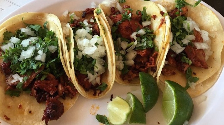 a plate of tacos al pastor