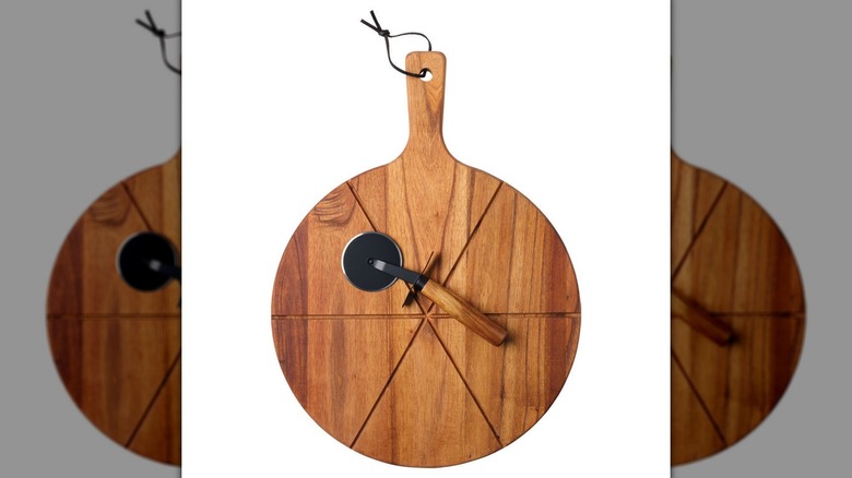 Wooden pizza peel and metal cutting wheel