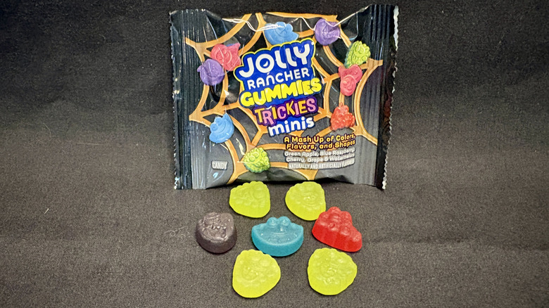 Jolly Rancher gummies on black background with package