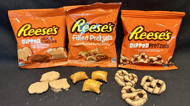 three bags of Reese's pretzels and snacks