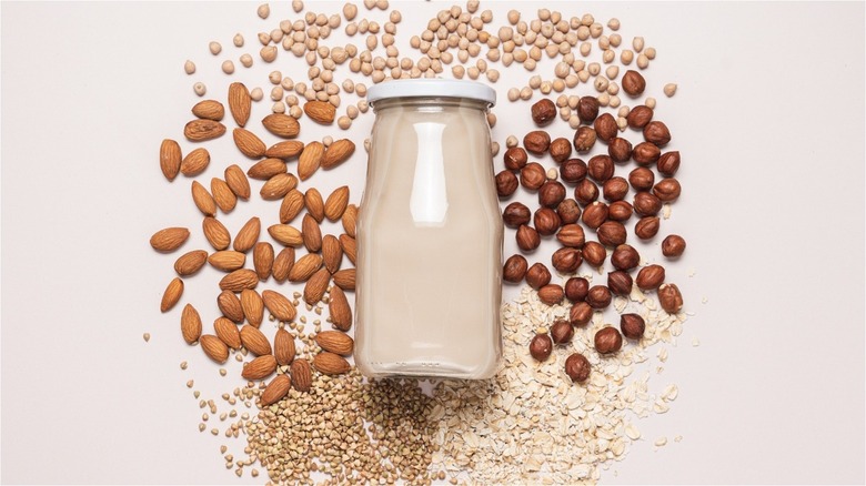 mason jar of plant-based milk with nuts