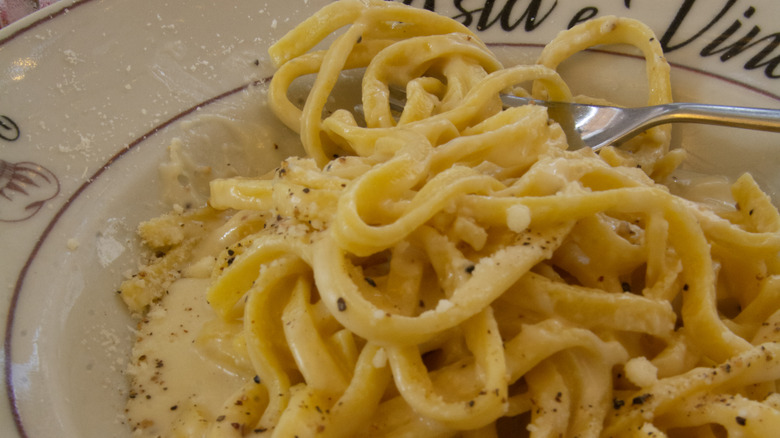 Cacio e pepe served over long flat noodles