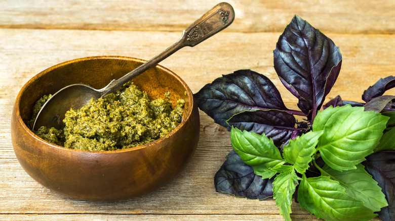Pesto alla Genovese sauce in wooden bowl