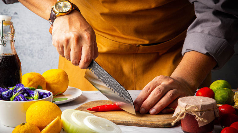 Man using a santoku knife