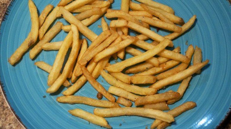 Close up of fries on a blue plate