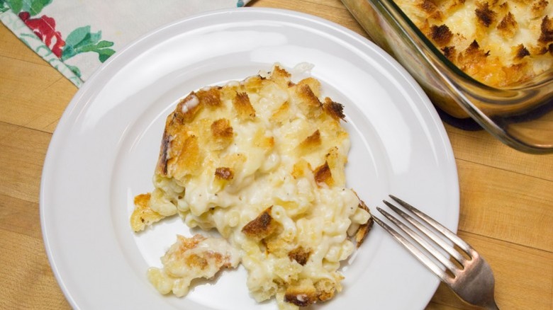 Mac and cheese on a white plate with a fork