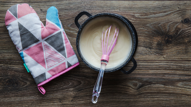 whisking food in saucepan