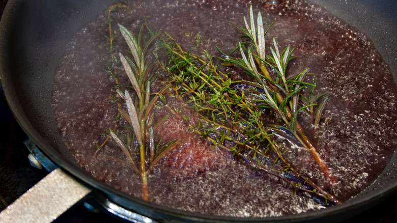 Deglazing pan with red wine and rosemary