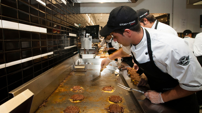 Steak 'n Shake employees in black caps