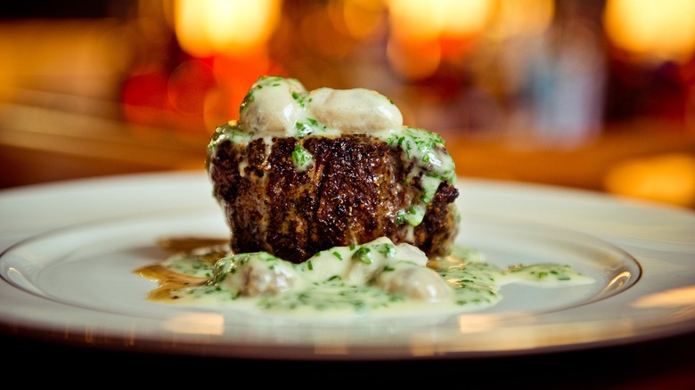 Steak topped with oysters and bearnaise