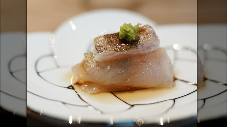 Dry-aged and reduced fluke with chives carefully crafted