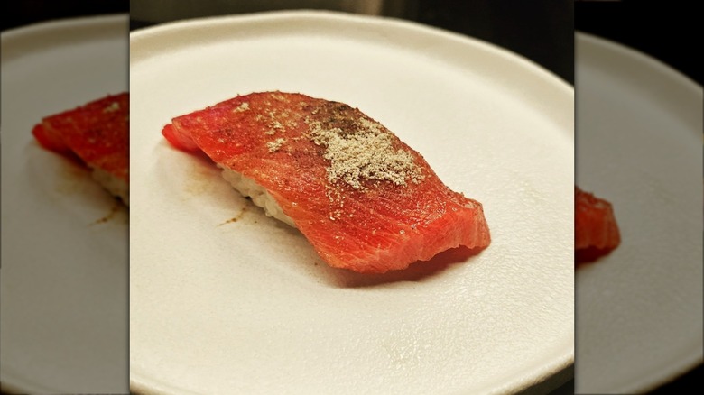 Raw salmon on rice on a plate