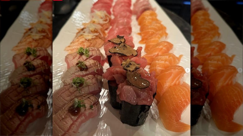 Rows of raw fish sushi rolls