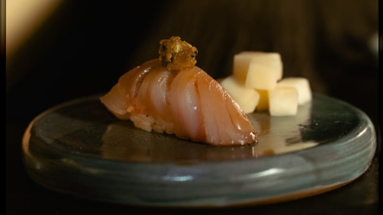 Japanese yellowtail nigiri, topped with a charred shishito salsa verde