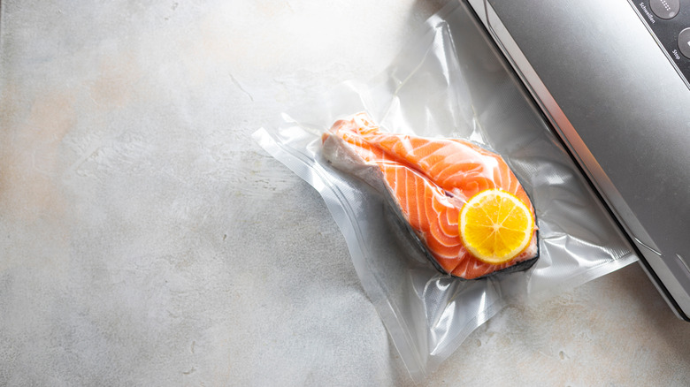 Salmon in a vaccum seal bag with lemon