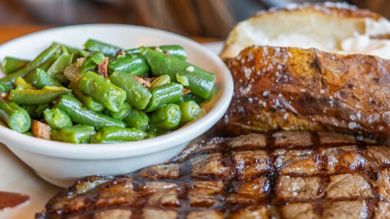 green beans served with steak and baked potato at Texas Roadhouse
