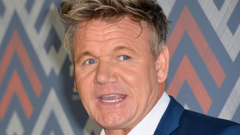 Gordon Ramsay in blue suit and white shirt