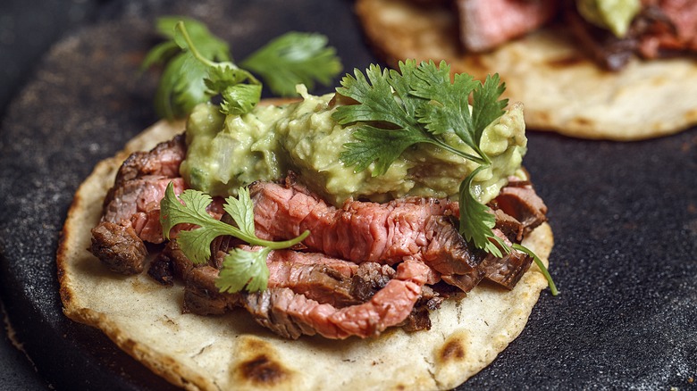 Grilled flank steak with guacamole