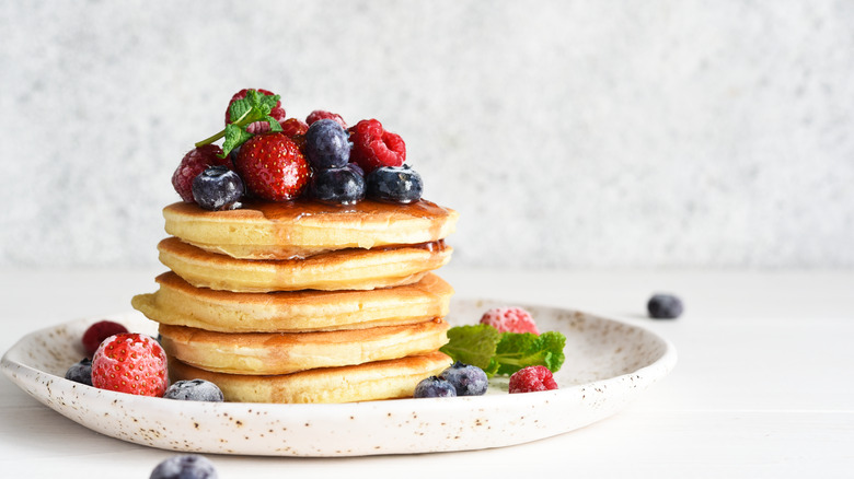Pancakes with berries on plate