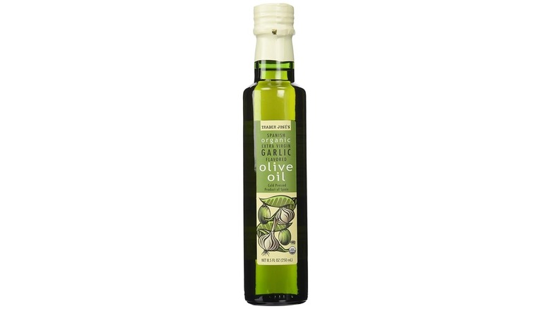 Bottle of Trader Joe's garlic infused olive oil on white background