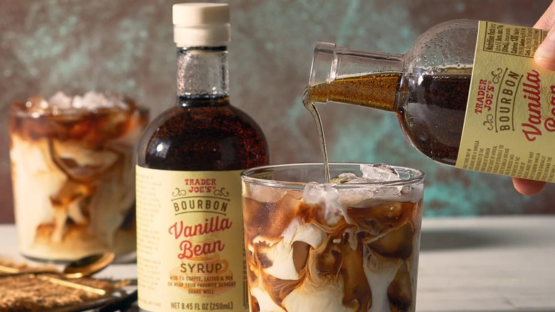 Trader Joe's Bourbon Vanilla Bean Syrup being poured into a drink
