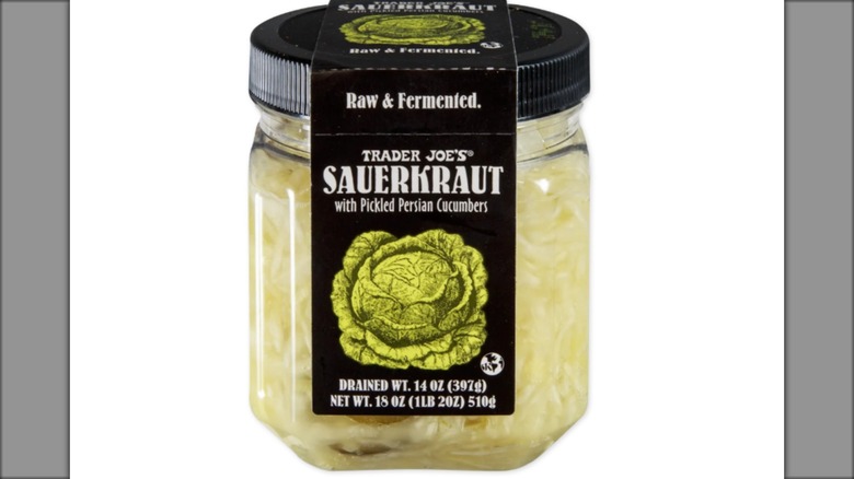 jar of sauerkraut with persian cucumbers