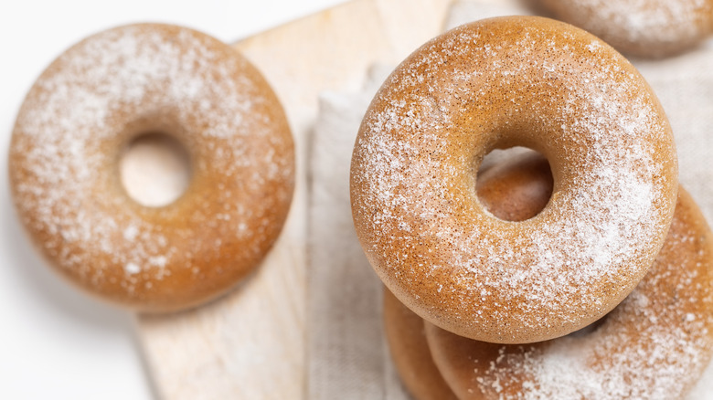 donuts sprinkled with powdered sugar