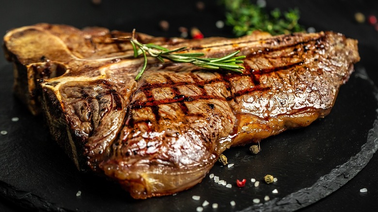 seared steak on wooden surface
