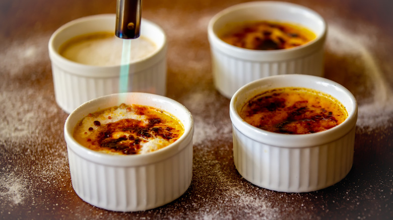 Crème brûlée being blowtorched 