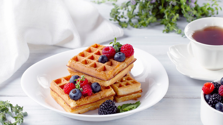 three waffles stacked with berries