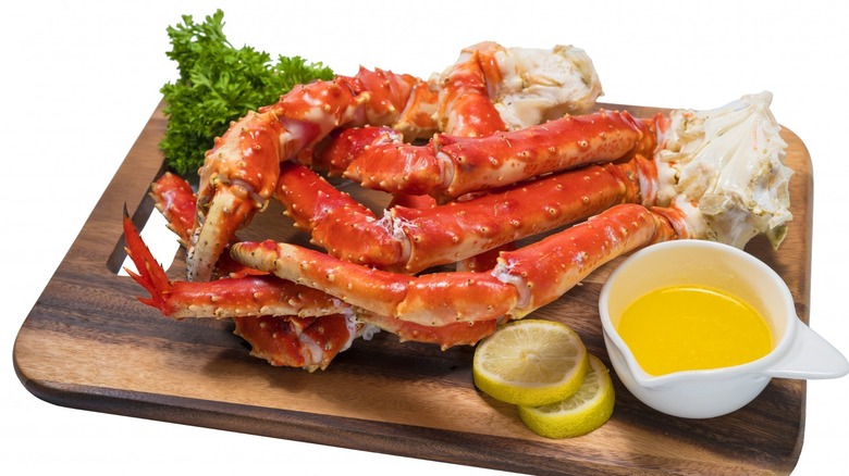 Crab legs served with lemon and butter