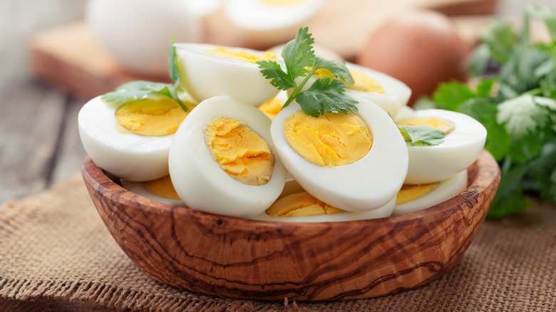 Wood bowl full of hard-boiled eggs