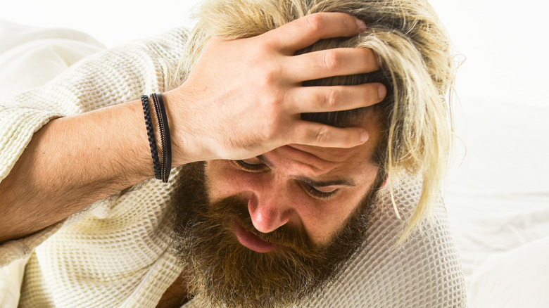 Man holding his head