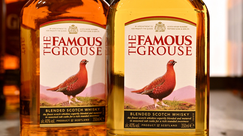 Two bottles of The Famous Grouse whiskey