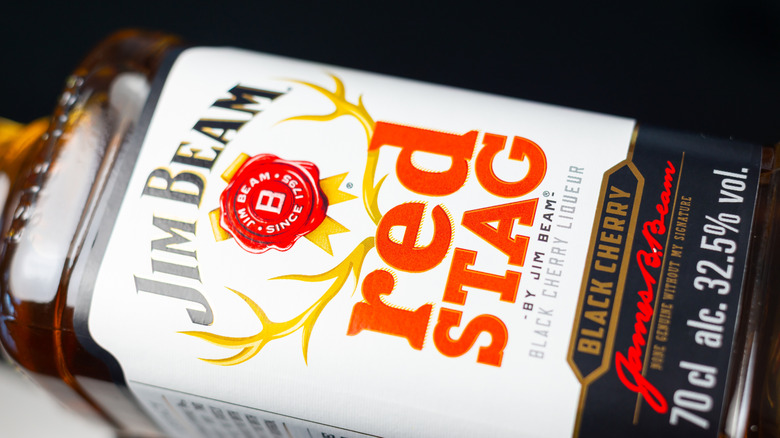 Bottle of Jim Beam Red Stag laying on its side