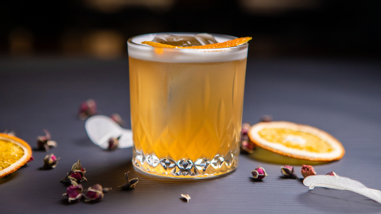 Whiskey sour on ice with cherry