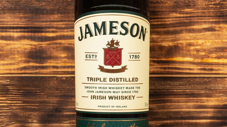 Bottle of Jameson on wooden background