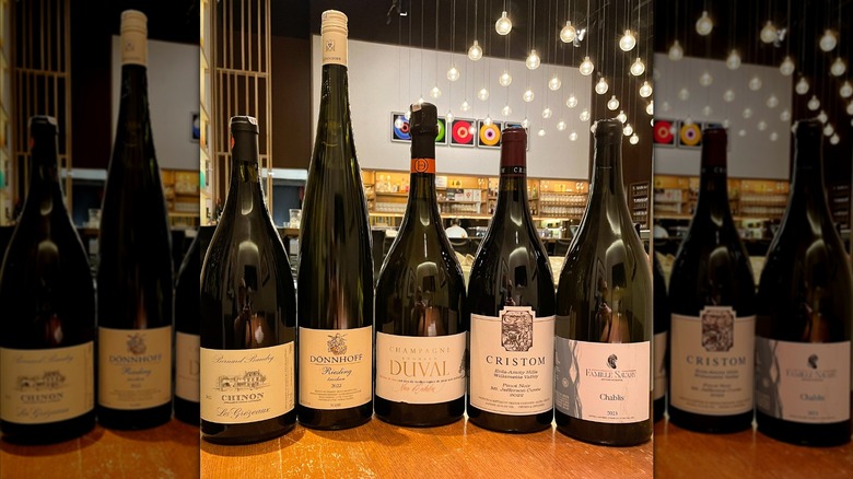 5 bottles of wine, including Chinon, Donnhoff riesling, champagne Duval, Christom Pinot noir, and Famille Savary Chablis.