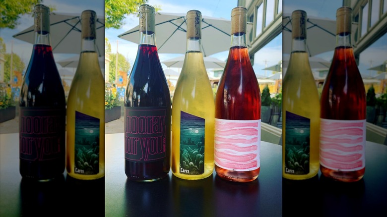 3 bottles of wine on an outdoor table