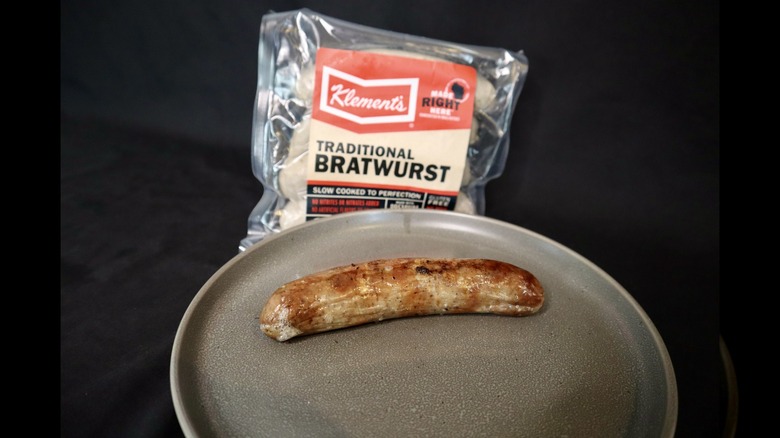 Kement's bratwurst on plate next to package